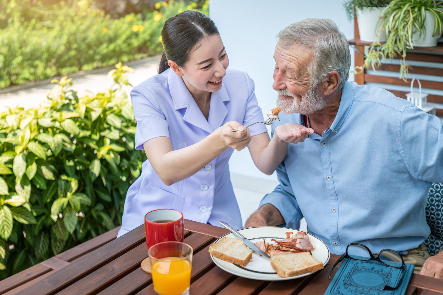 senior man eat breakfast nursing home