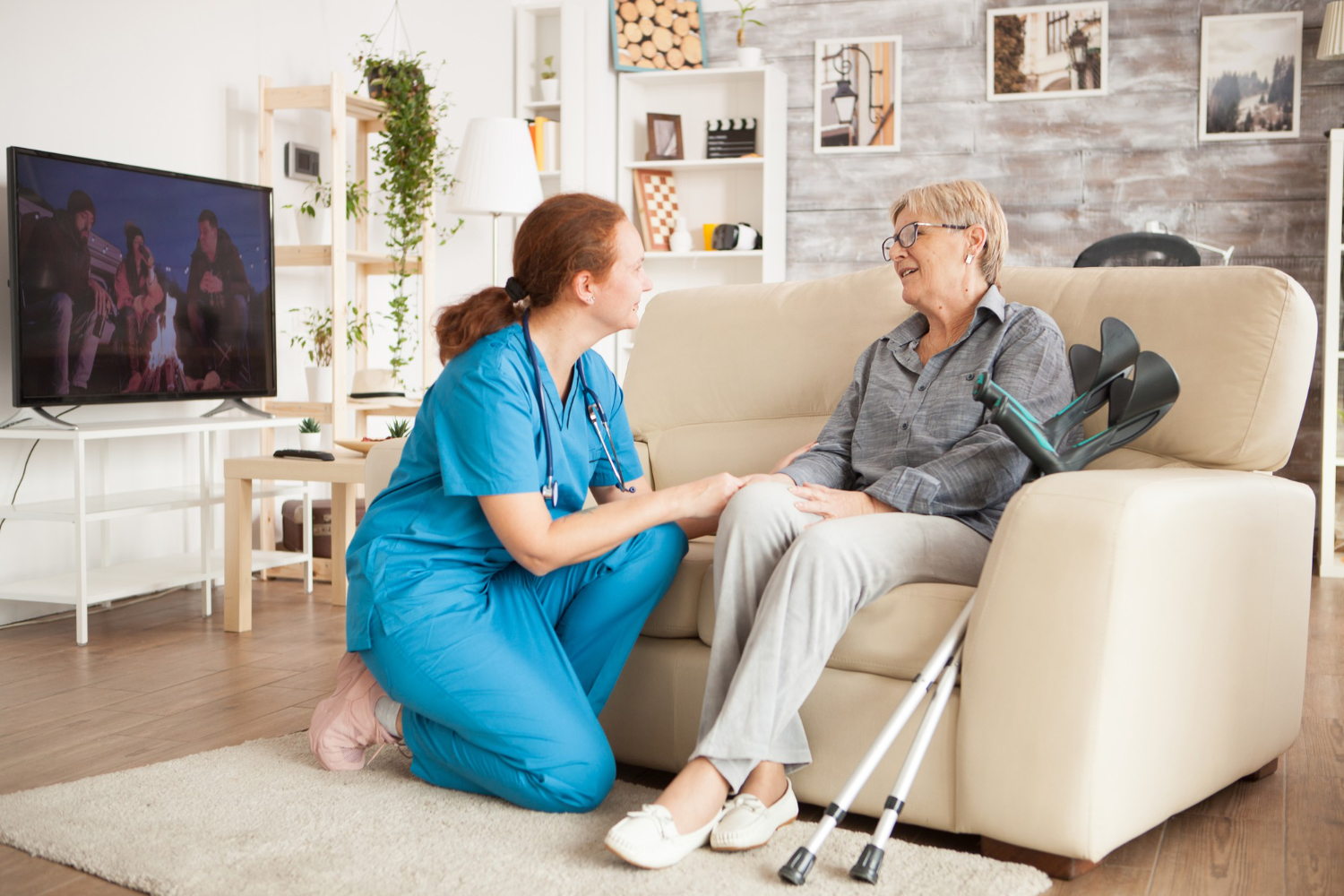 young female nurse with senior woman nursing home